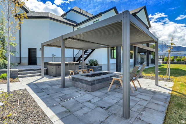 1720 Hillcrest Circle Mapleton, UT 84664 - Photo 100 of 116 View of patio / terrace featuring a hot tub, a fire pit, and a mountain view