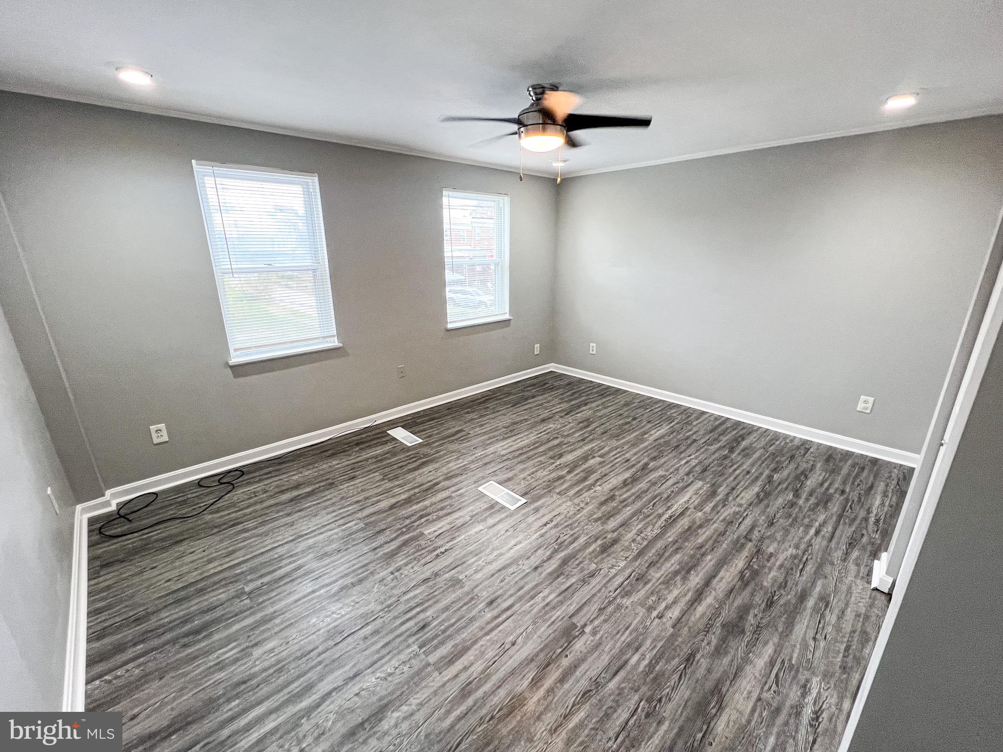7404 Kirtley Road Baltimore, MD 21222 - Photo 14 of 16 a view of an empty room with a window