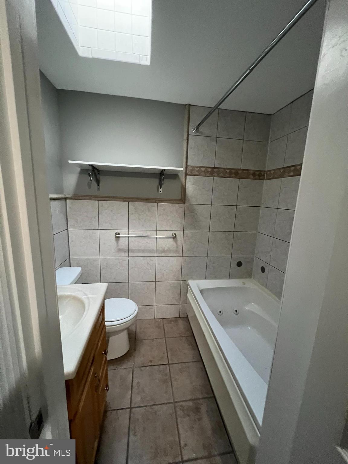 7404 Kirtley Road Baltimore, MD 21222 - Photo 10 of 16 a bathroom with a sink and mirror