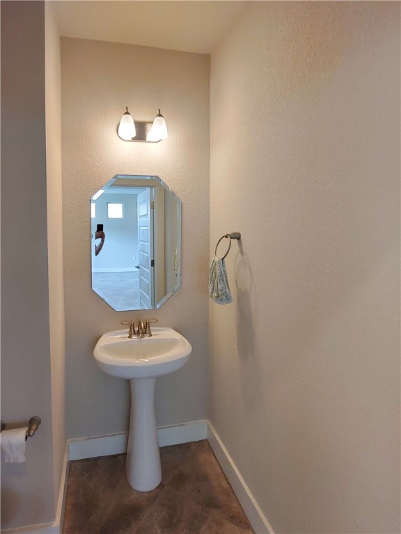 9303 McKnight Loop Austin, TX 78717 - Photo 12 of 18 a bathroom with a sink mirror and toilet