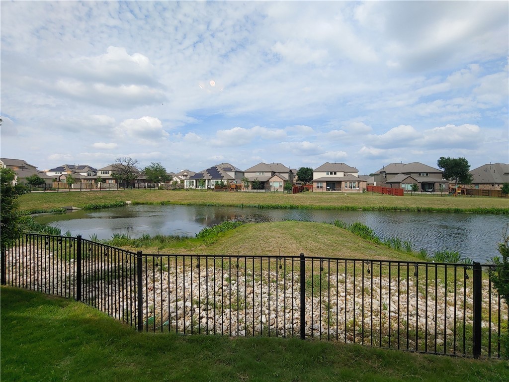 9303 McKnight Loop Austin, TX 78717 - Photo 18 of 18 a view of a lake with houses in the background