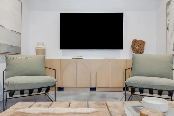 a living room with a couch and a flat screen tv