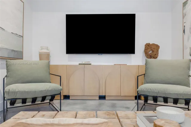 a living room with a couch and a flat screen tv