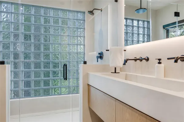 a bathroom with a bathtub and a sink