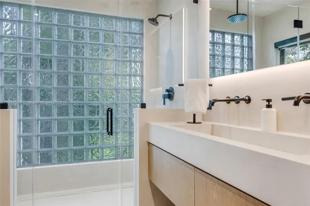 a bathroom with a bathtub and a sink