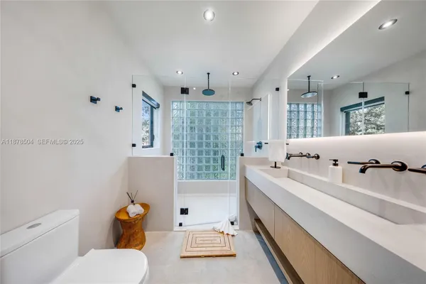 a large white room with a couch and a toilet