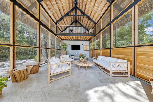 a view of living room with furniture and flat screen tv