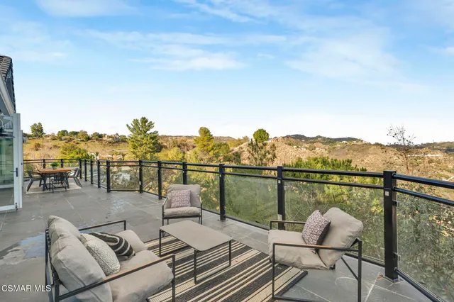 a view of a house with a mountain in the background
