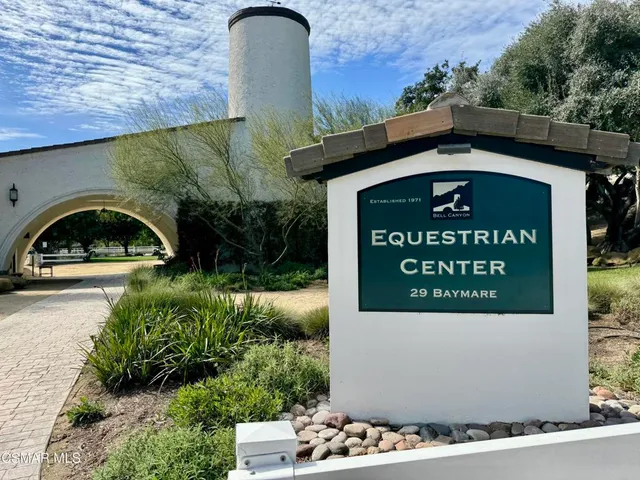 a view of a porch with wooden fence