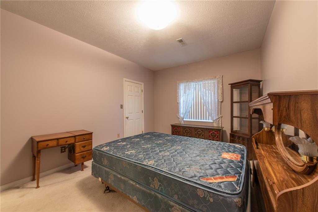 61 David Drive Lower Burrell, PA 15068 - Photo 14 of 29 a bedroom with a bed and a window