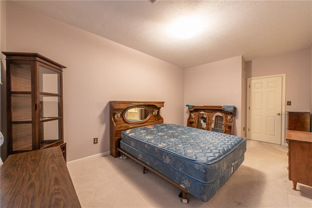 61 David Drive Lower Burrell, PA 15068 - Photo 15 of 29 a bedroom with a bed and wooden floor