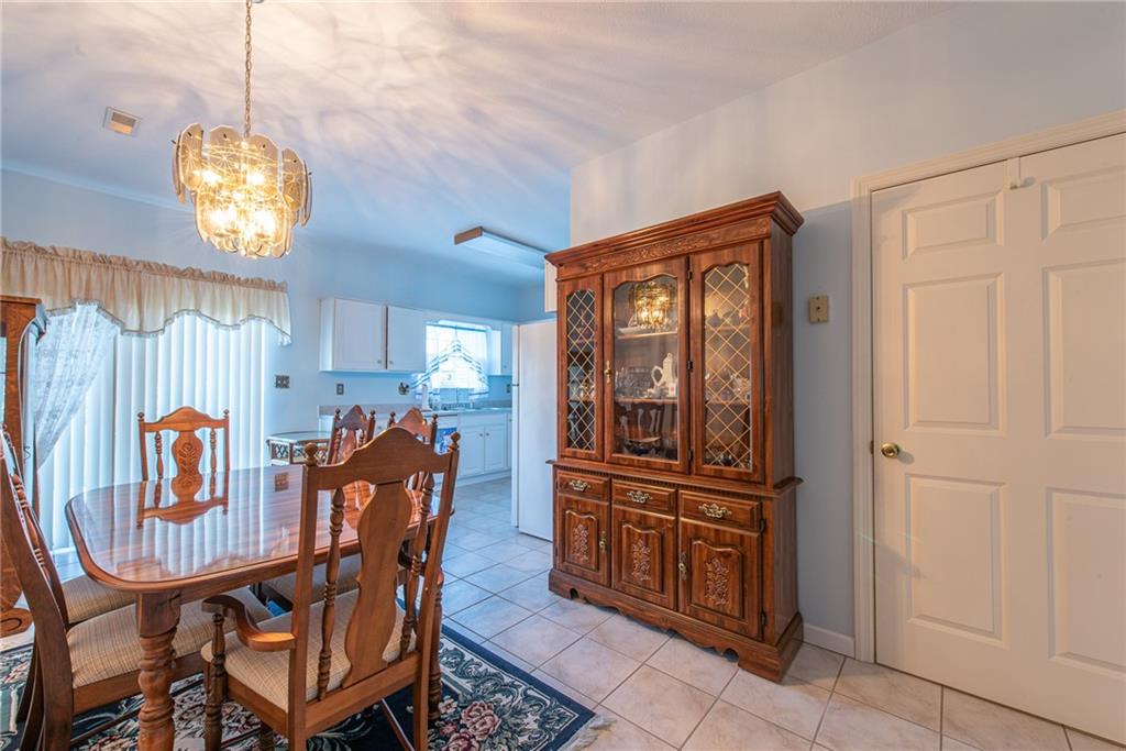 61 David Drive Lower Burrell, PA 15068 - Photo 5 of 29 a view of a dining room with furniture and chandelier