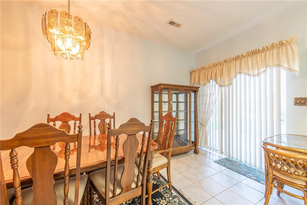 61 David Drive Lower Burrell, PA 15068 - Photo 7 of 29 a view of a dining room with furniture and chandelier