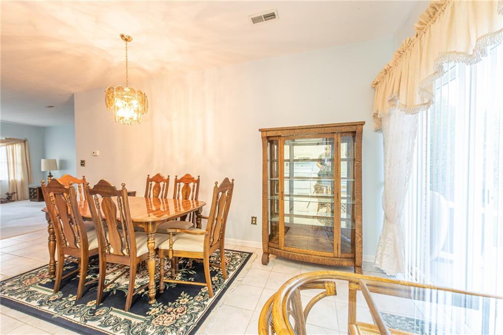 61 David Drive Lower Burrell, PA 15068 - Photo 8 of 29 a view of a dining room with furniture wooden floor and a chandelier