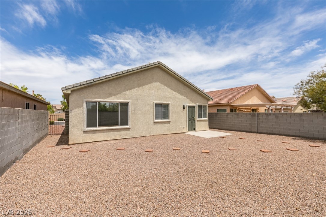 10959 Pumpkin Ridge Avenue Las Vegas, NV 89135 - Photo 35 of 51 A spacious, rock-filled backyard offers ample space for outdoor enjoyment.