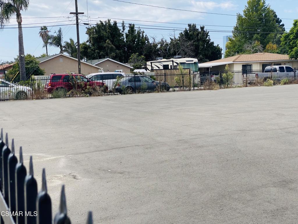 2701 Alvarado Street Oxnard, CA 93036 - Photo 6 of 7 a view of a house with floor to ceiling window and potted plants