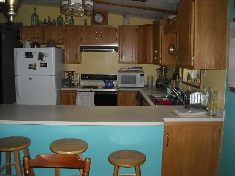 67 Perkins Athens, ME 04942 - Photo 10 of 12 Kitchen. U-shaped kitchen opens into...
