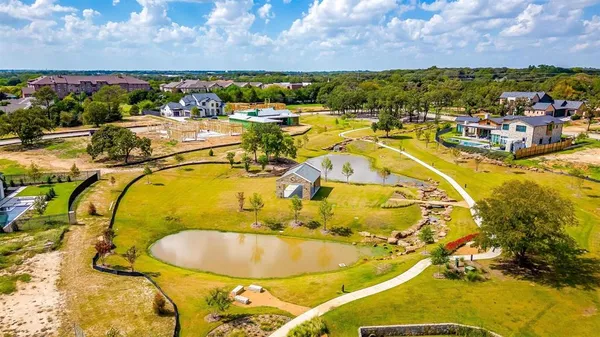 a view of a swimming pool with a table and chairs