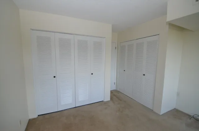 a kitchen with a refrigerator sink stove and cabinets
