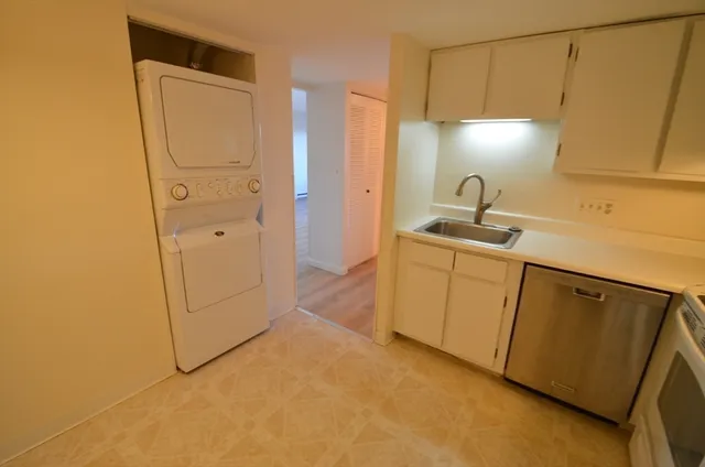 view of door with utility room