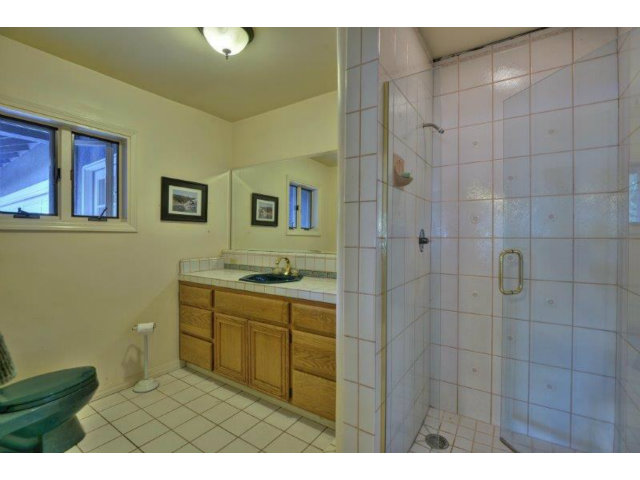 3852 Higuera Road San Jose, CA 95148 - Photo 12 of 25 a bathroom with a sink a toilet and shower