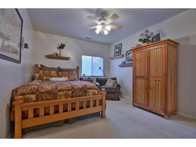 3852 Higuera Road San Jose, CA 95148 - Photo 13 of 25 a bedroom with bed and wooden floor