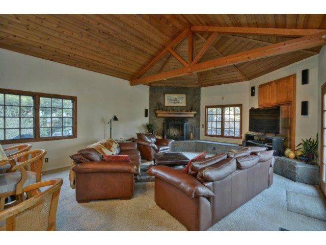 3852 Higuera Road San Jose, CA 95148 - Photo 5 of 25 a living room with furniture a fireplace and a flat screen tv