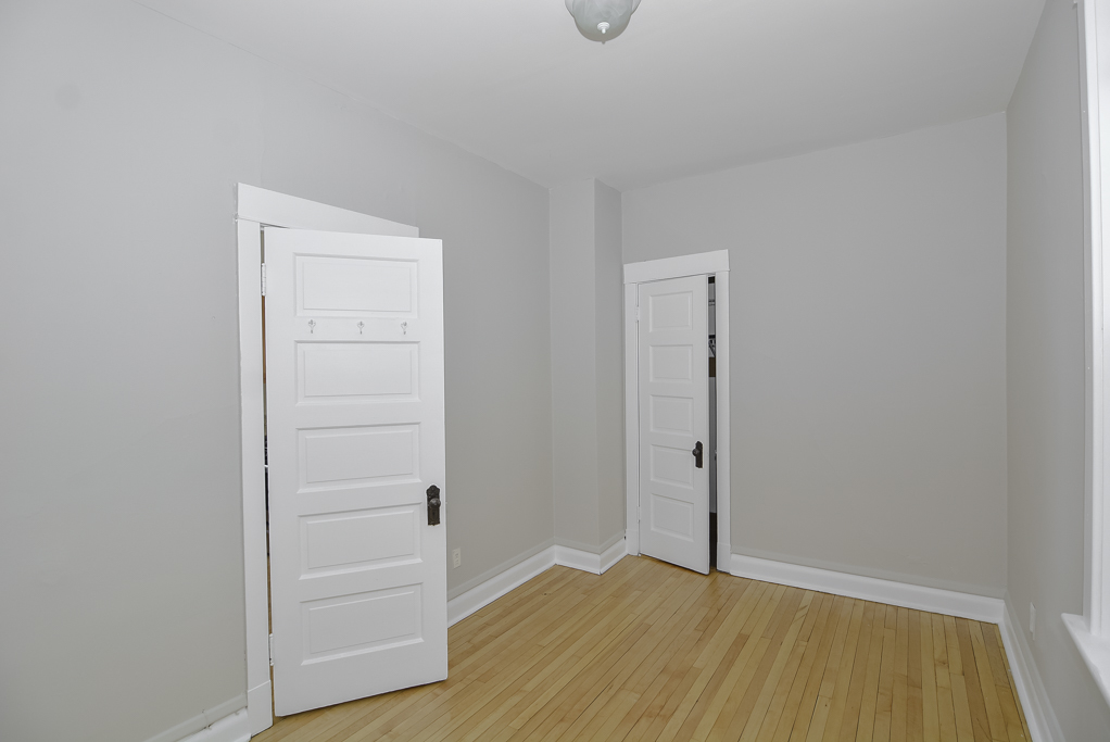 2230 West Iowa Street, Unit 3 Chicago, IL 60622 - Photo 12 of 19 an empty room with wooden floor and closet