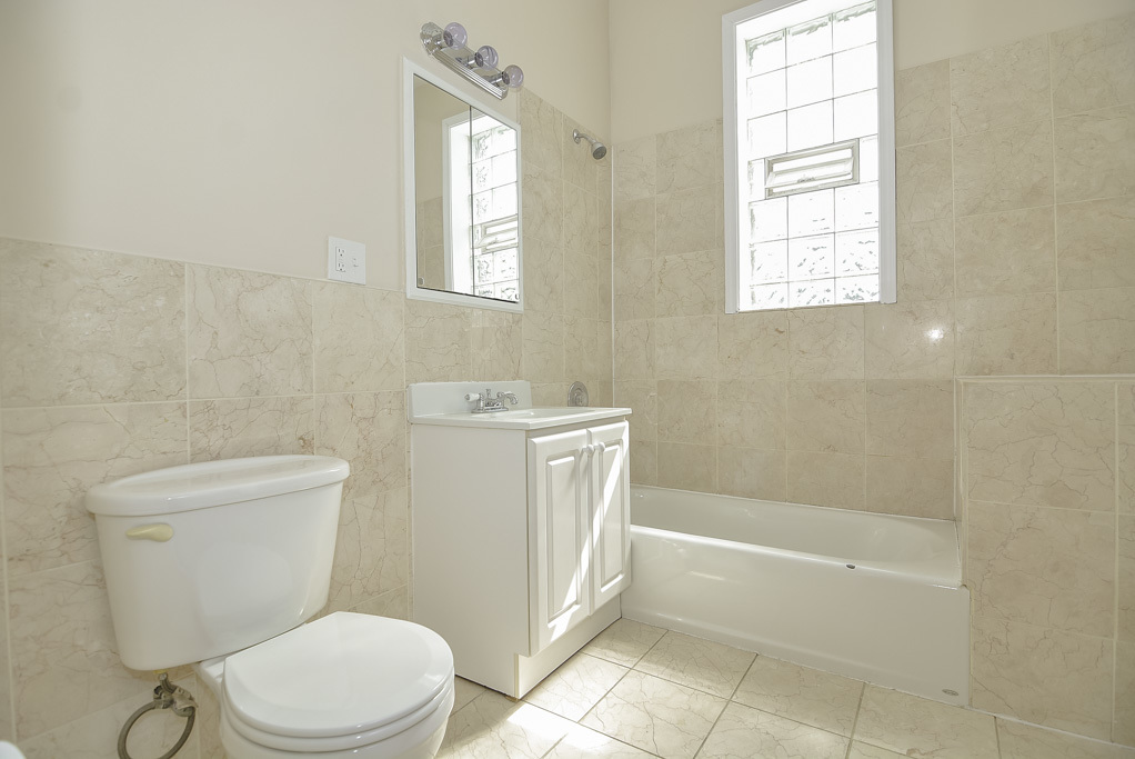 2230 West Iowa Street, Unit 3 Chicago, IL 60622 - Photo 15 of 19 a bathroom with a toilet a sink and a bathtub