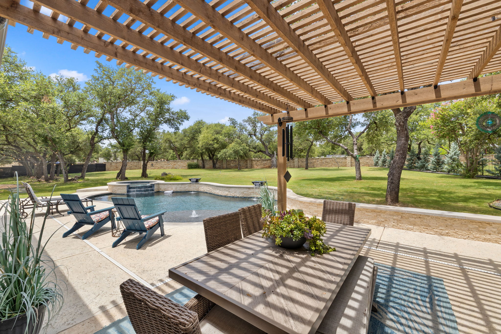 104 Lower Cedar Cove Georgetown, TX 78633 - Photo 26 of 37 a view of a patio with a table chairs and a patio