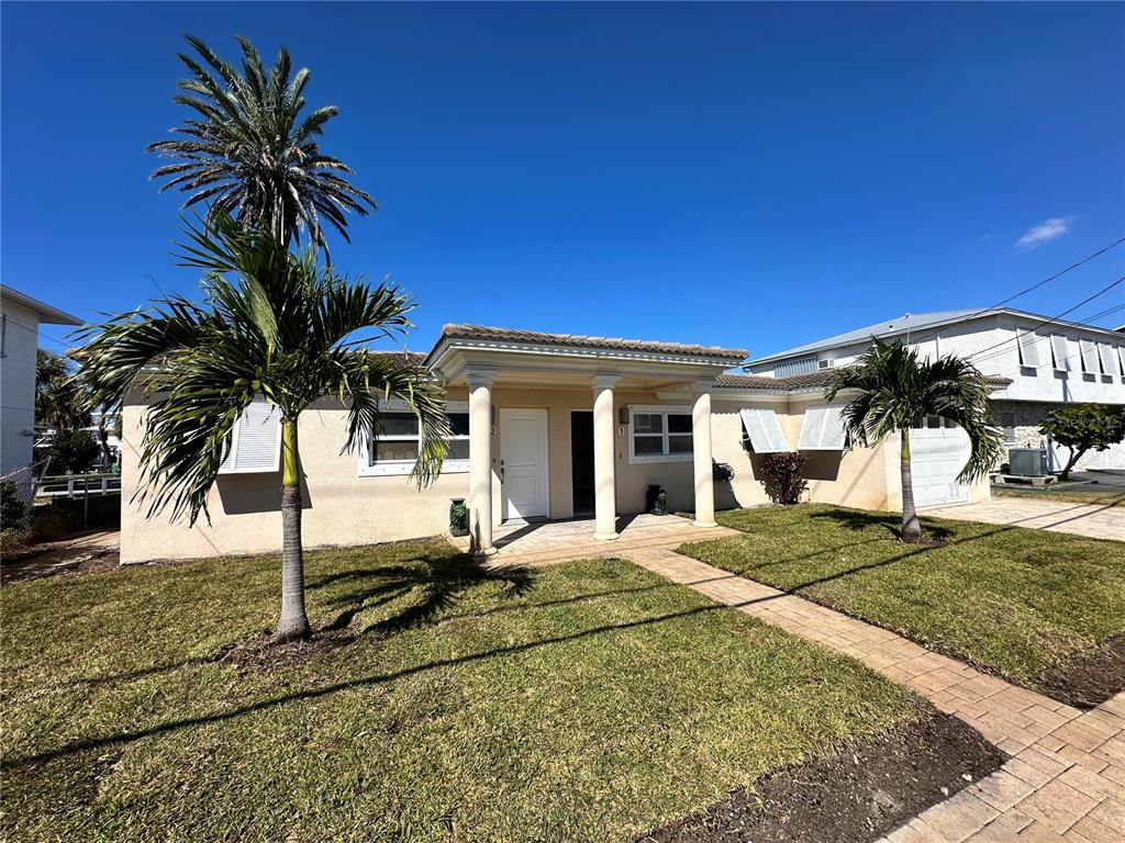 Undisclosed Address Madeira Beach, FL 33708 - Photo 1 of 1 a view of a house with a patio