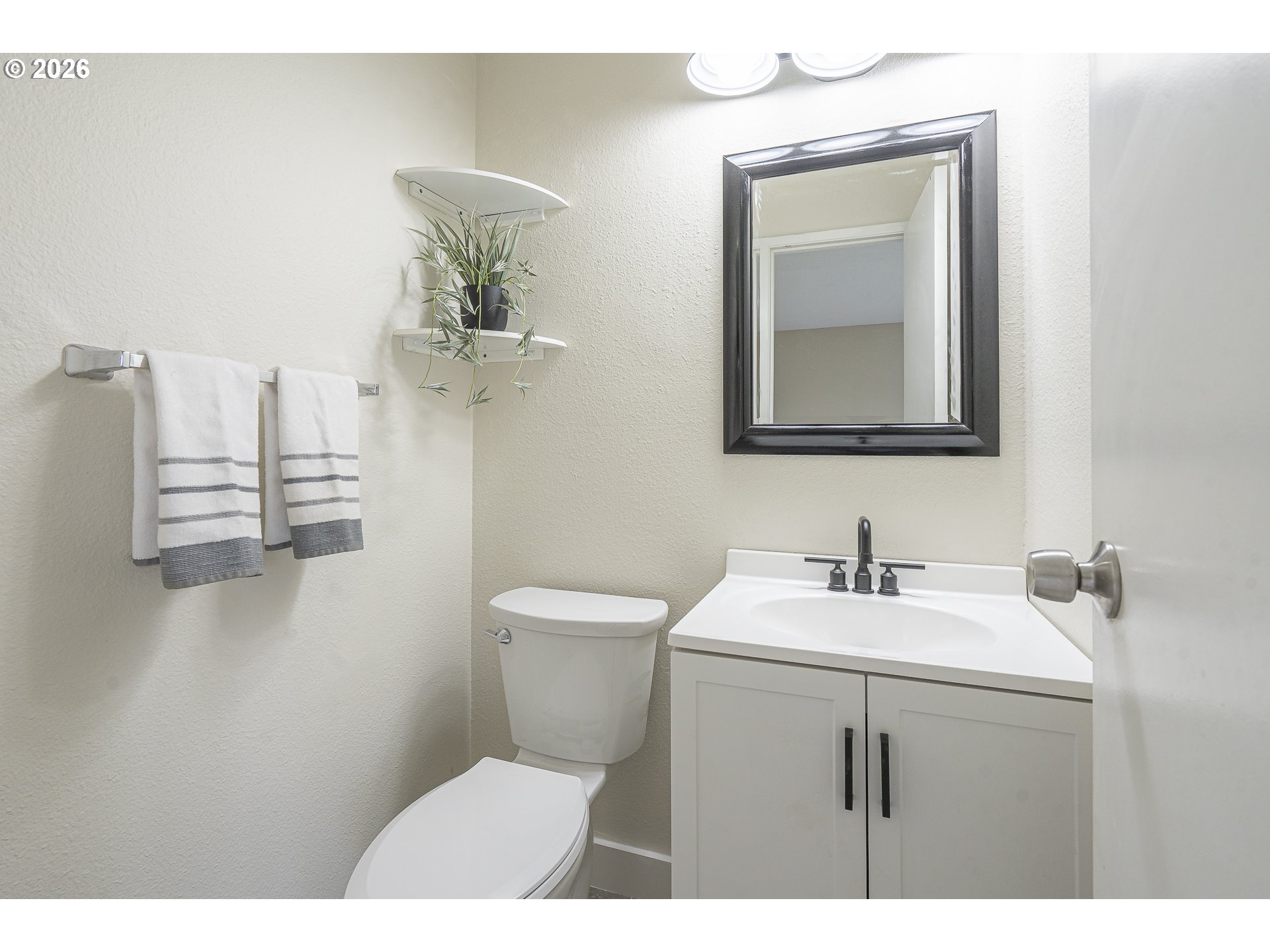 8315 Southwest Shenandoah Way Tualatin, OR 97062 - Photo 20 of 29 a bathroom with a sink a toilet and mirror