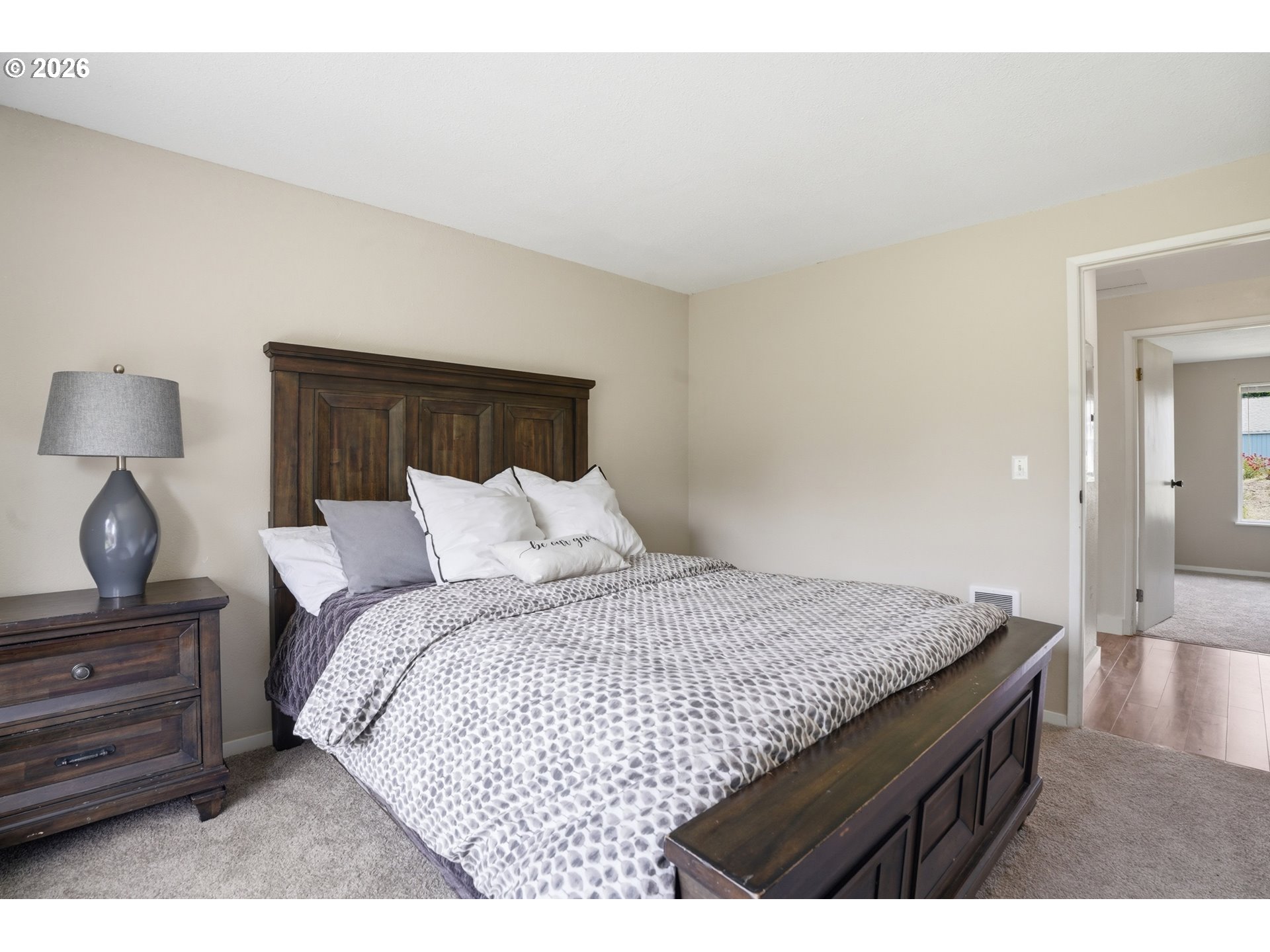 8315 Southwest Shenandoah Way Tualatin, OR 97062 - Photo 28 of 29 a bedroom with a bed and wooden floor