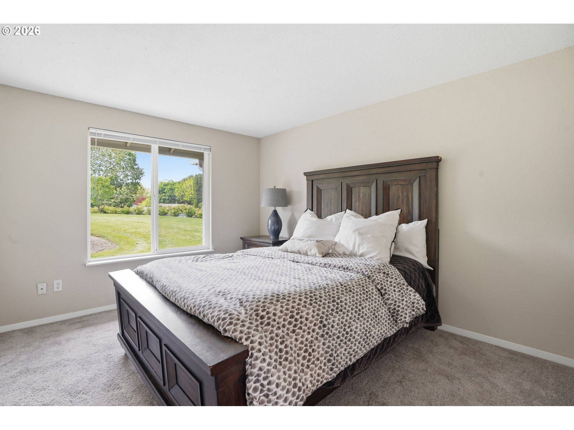 8315 Southwest Shenandoah Way Tualatin, OR 97062 - Photo 29 of 29 a bedroom with a bed and window