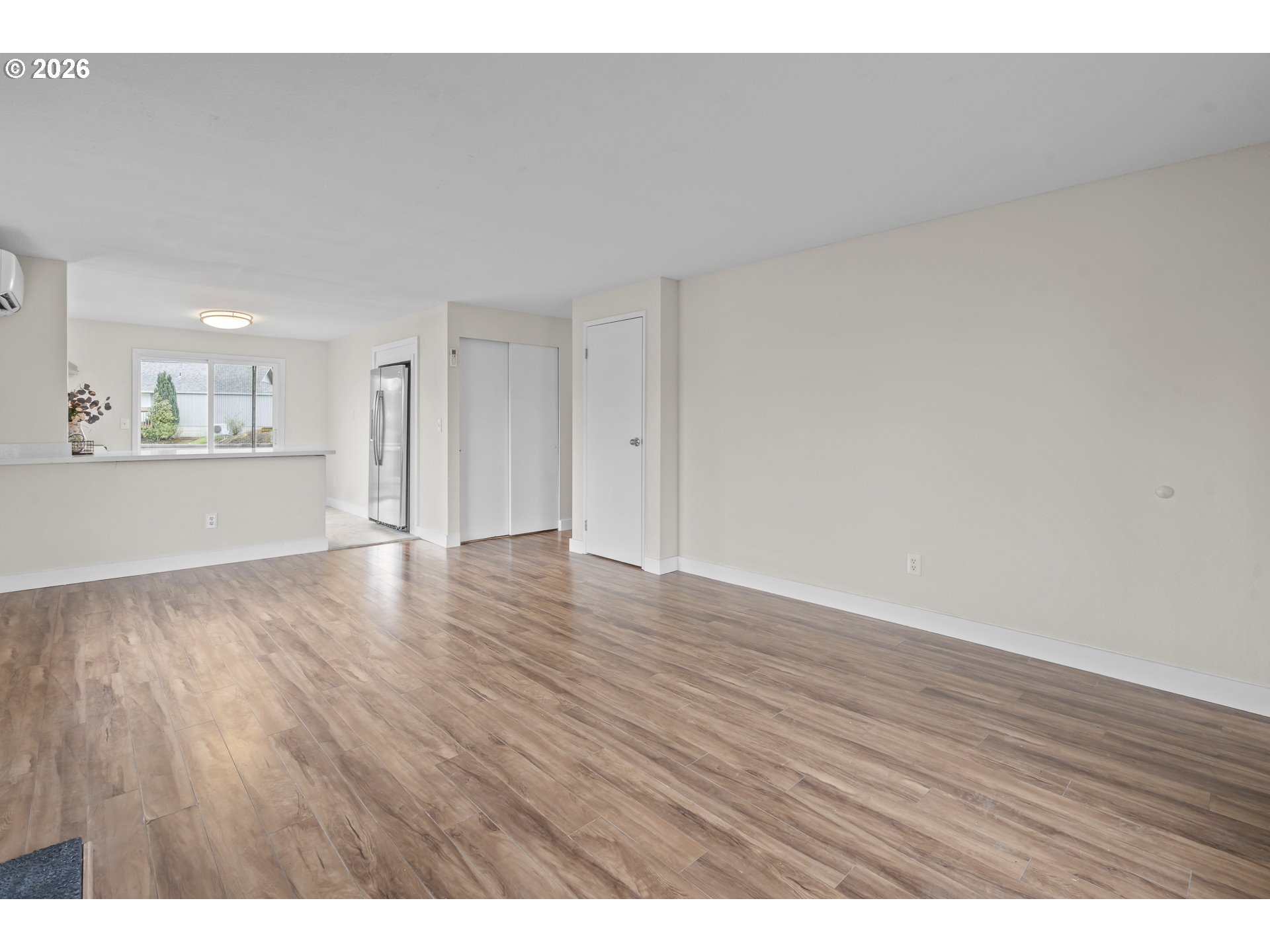 8315 Southwest Shenandoah Way Tualatin, OR 97062 - Photo 4 of 29 a view of an empty room and wooden floor