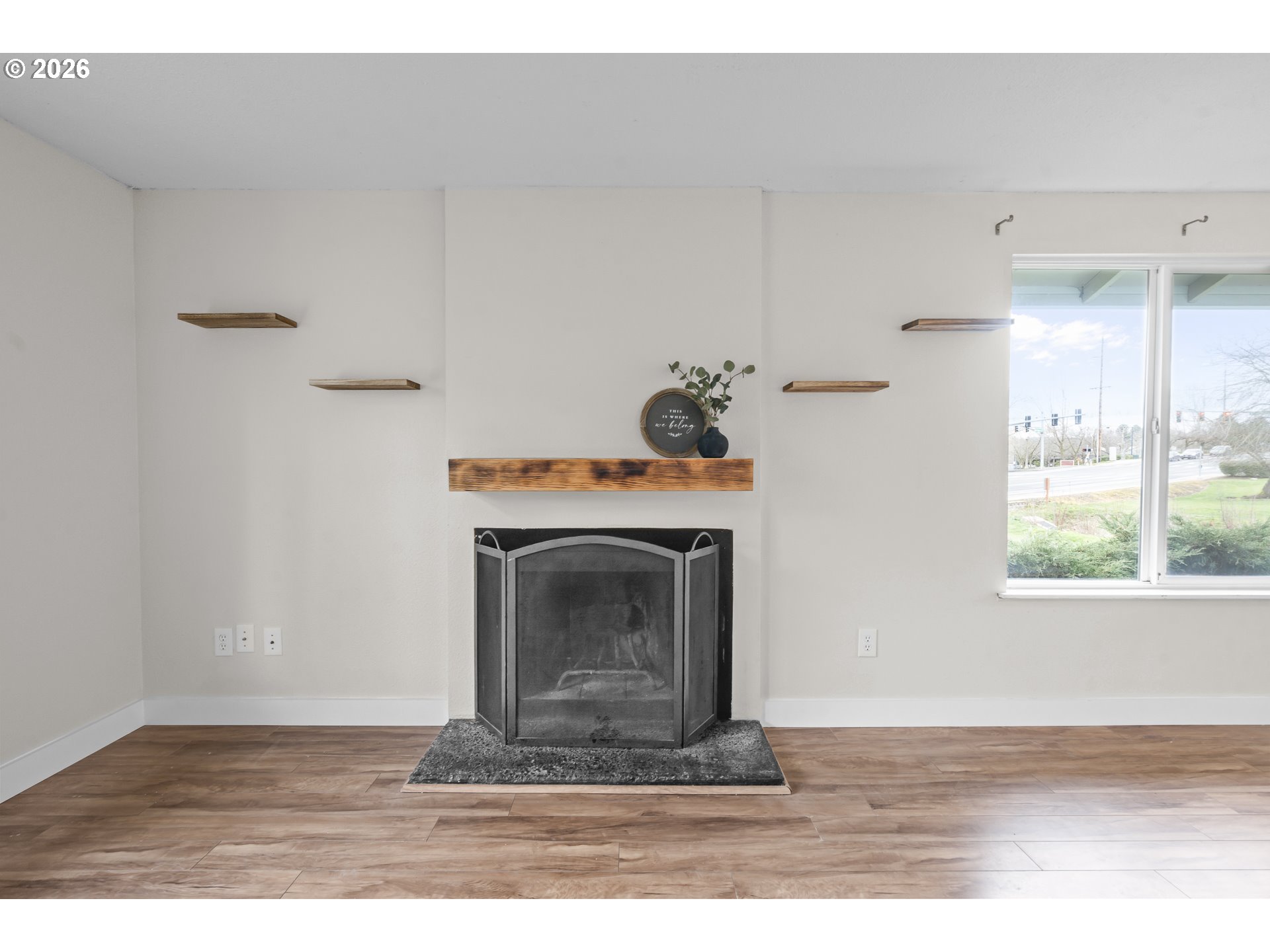 8315 Southwest Shenandoah Way Tualatin, OR 97062 - Photo 5 of 29 a living room with a fireplace and a window