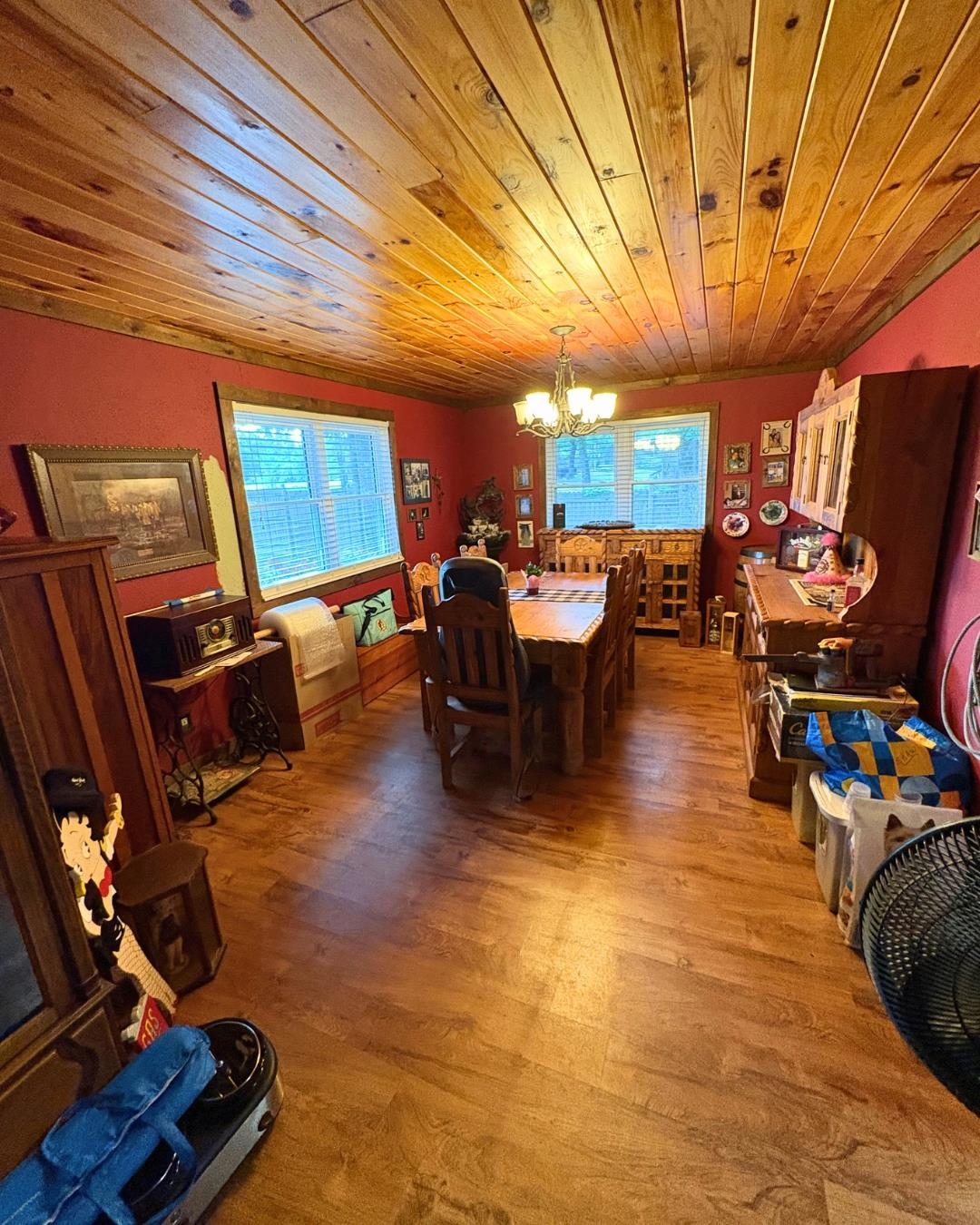 772 Rushing Road Michie, TN 38357 - Photo 3 of 19 Wood-finish flooring throughout, complemented by a natural wood plank ceiling