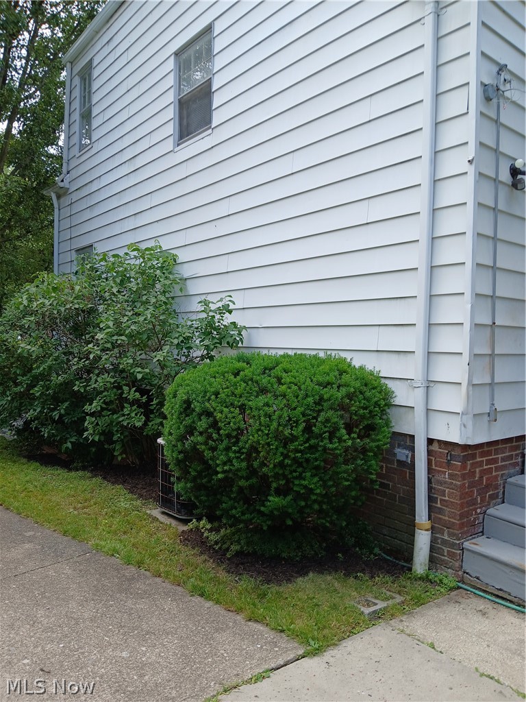 4313 Prasse Road South Euclid, OH 44121 - Photo 29 of 29 White siding exterior with a brick accent