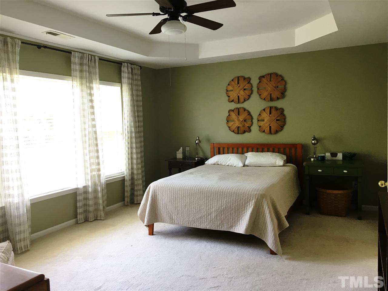 7404 Silver View Lane Raleigh, NC 27613 - Photo 10 of 21 Tranquil Master Suite features trey ceiling with ceiling fan.