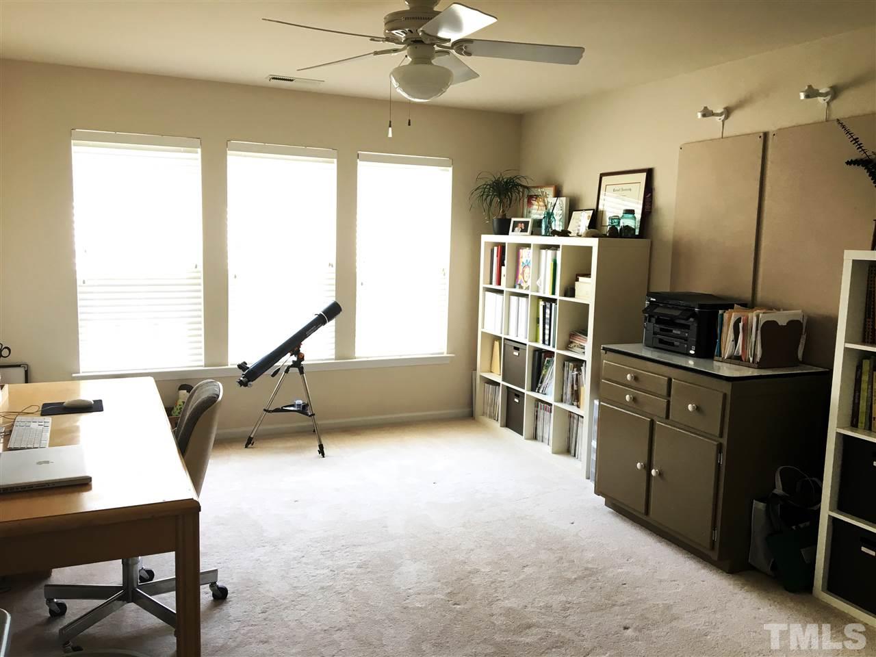 7404 Silver View Lane Raleigh, NC 27613 - Photo 14 of 21 Currently used as a study, this spacious room can be the fourth bedroom or bonus room.
