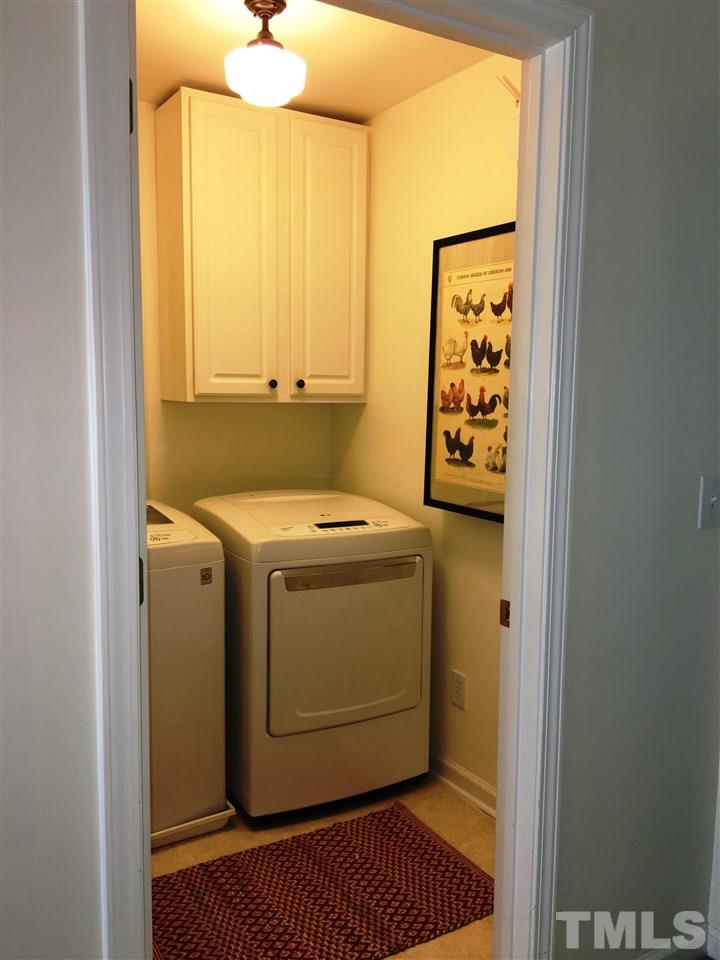 7404 Silver View Lane Raleigh, NC 27613 - Photo 16 of 21 Laundry room, centrally located on the second floor comes with designer light fixture and High Efficiency LG Washer and Dryer!