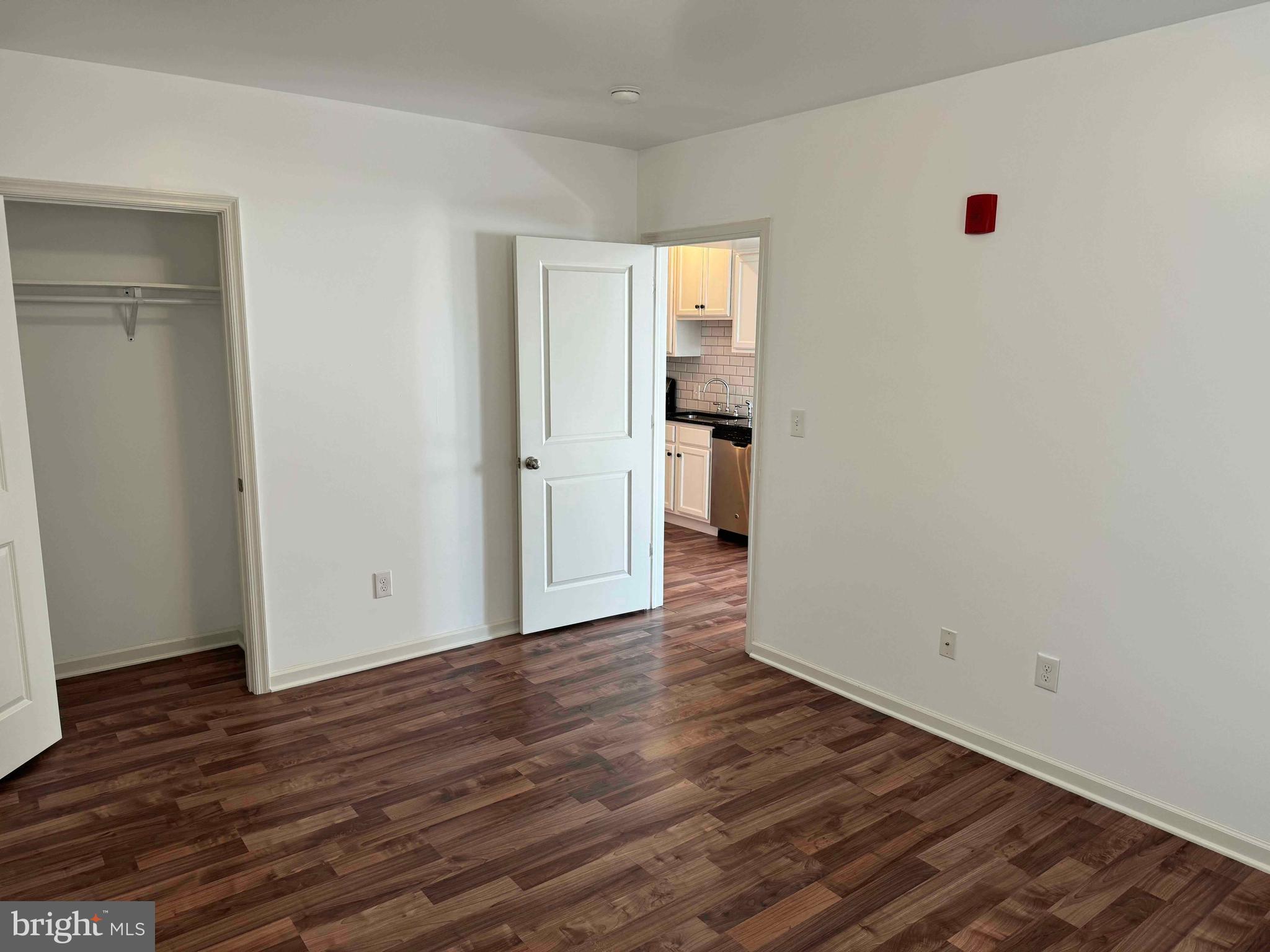 5261 Ridge Avenue, Unit 206 Philadelphia, PA 19128 - Photo 5 of 10 a view of a room with wooden floor and a sink
