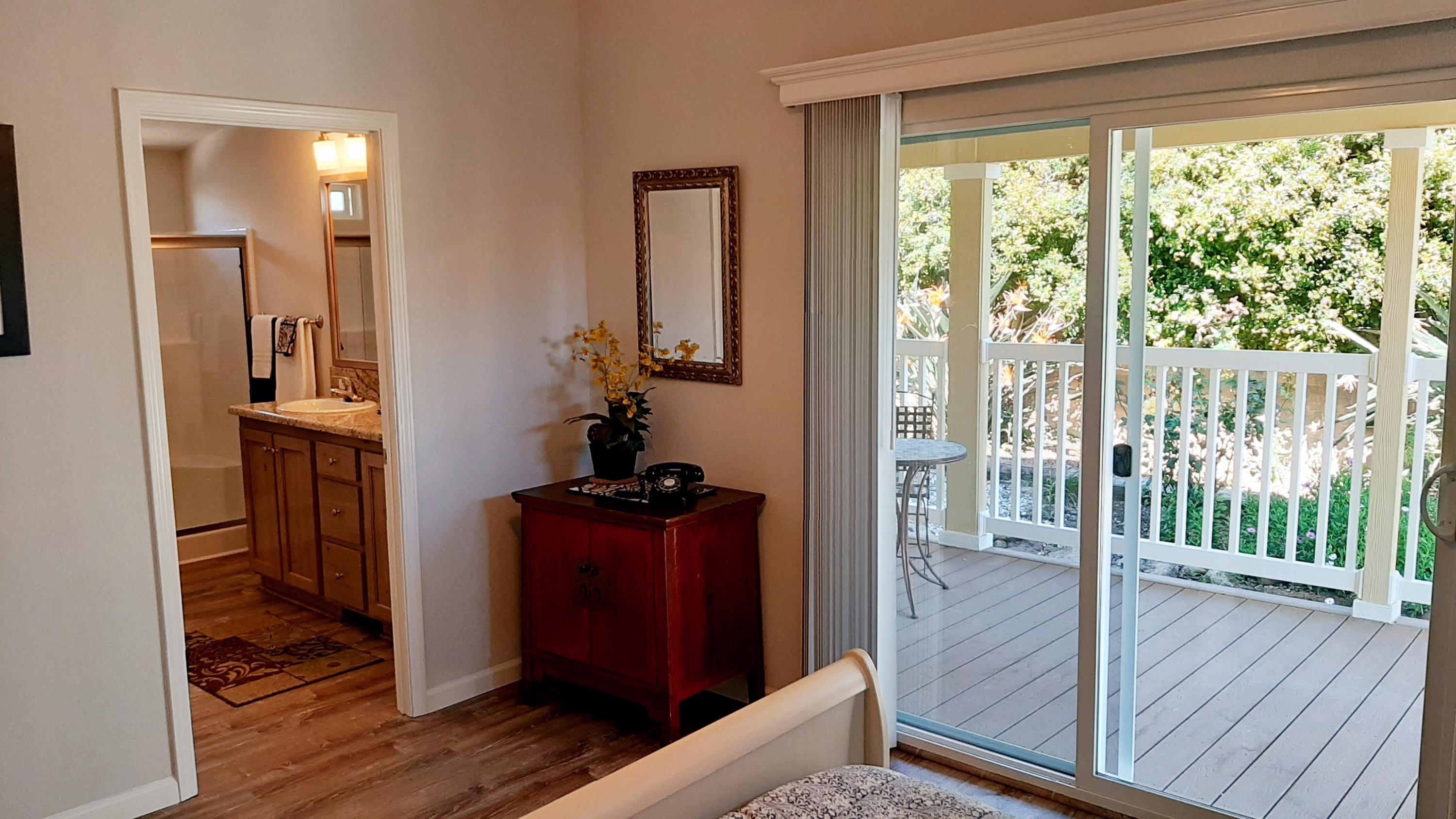 340 Old Mill Road, Unit 18 Santa Barbara, CA 93110 - Photo 8 of 22 a view of a hallway with wooden floor and windows