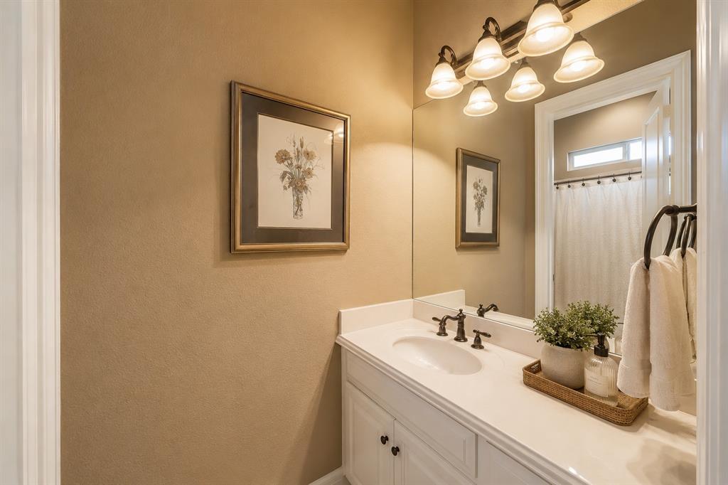 2726 Country Club Road Pantego, TX 76013 - Photo 17 of 23 a bathroom with a sink vanity and a mirror