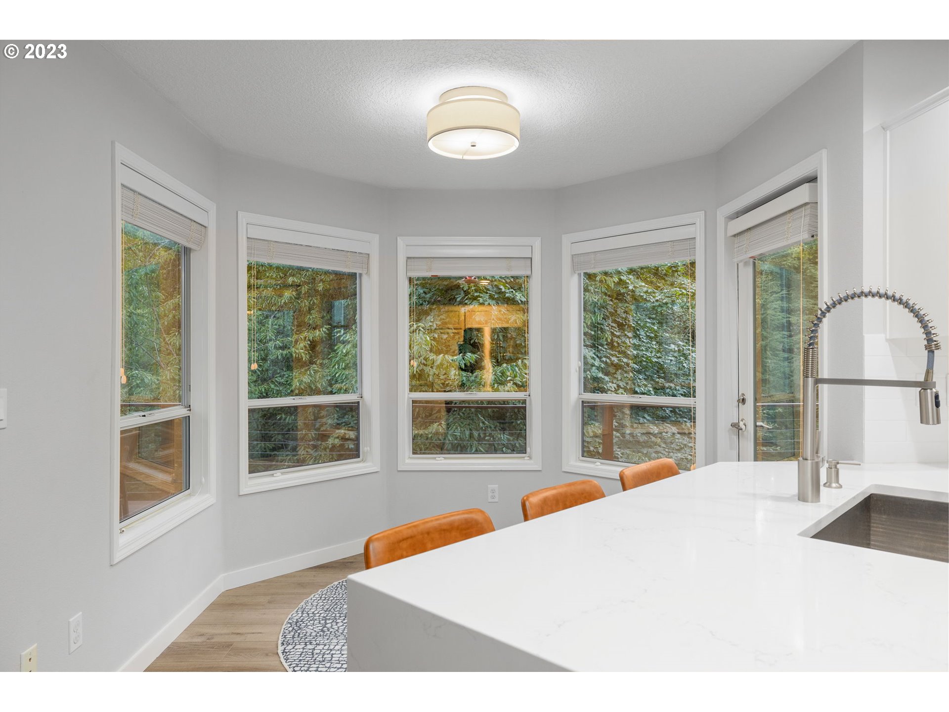 4806 Southwest Orchard Lane Portland, OR 97219 - Photo 11 of 35 a bedroom with a bed and a large window