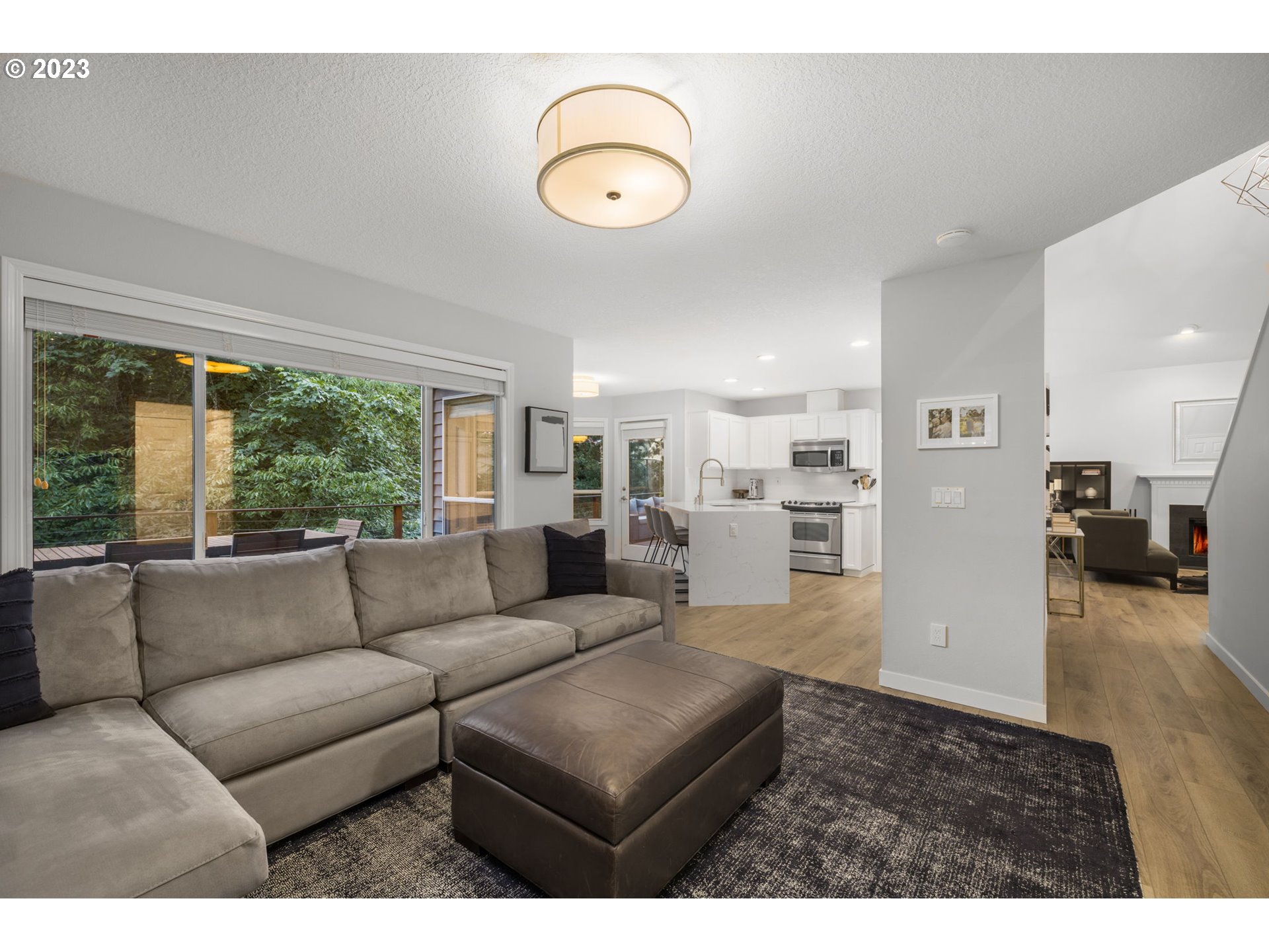 4806 Southwest Orchard Lane Portland, OR 97219 - Photo 15 of 35 a living room with furniture and a large window