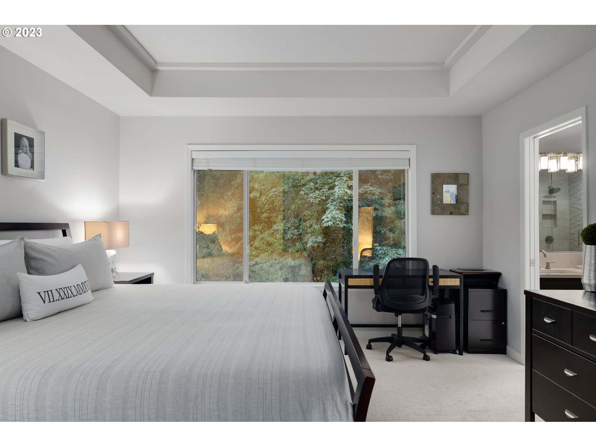 4806 Southwest Orchard Lane Portland, OR 97219 - Photo 20 of 35 a bedroom with a bed and a large window