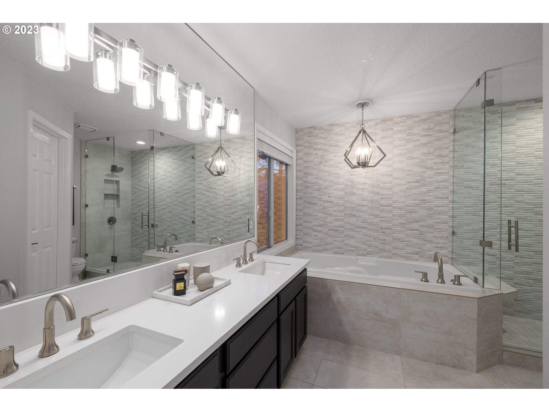 4806 Southwest Orchard Lane Portland, OR 97219 - Photo 23 of 35 a bathroom with a sink vanity granite tub shower and a mirror