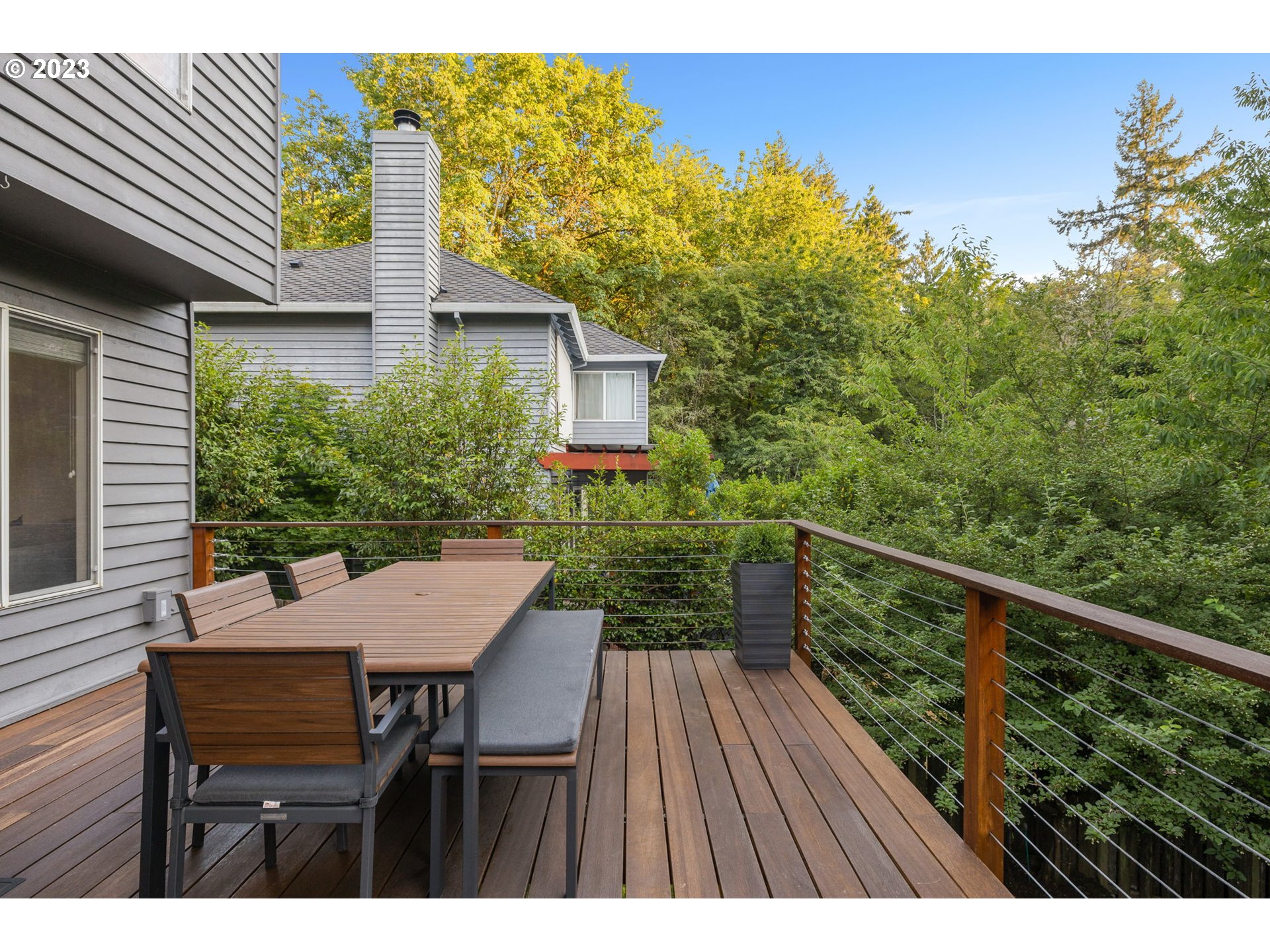 4806 Southwest Orchard Lane Portland, OR 97219 - Photo 27 of 35 a view of a table and chairs in patio of the house