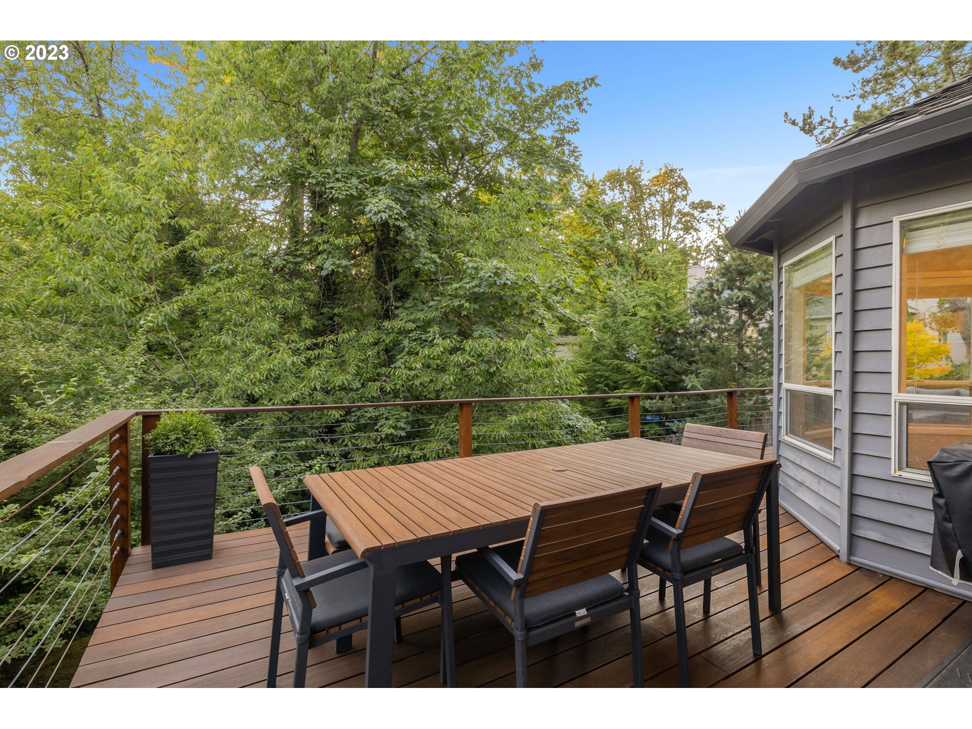 4806 Southwest Orchard Lane Portland, OR 97219 - Photo 31 of 35 a view of a dinning table and chairs on roof deck